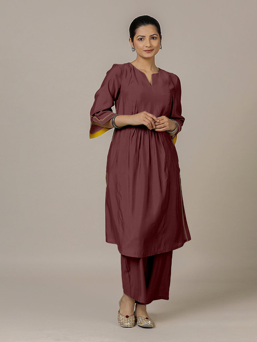 Nimrat x Rozaana Kurta, in Maroon Viscose, featuring three quarter sleeves and round neck with splitline.