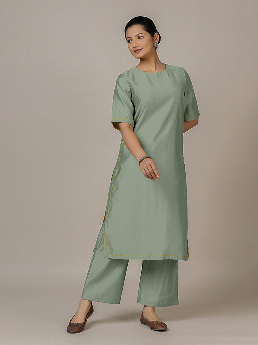 Riya x Rozaana Kurta, in Green Viscose, featuring elbow sleeves and jewel neckline, made for daily & work.