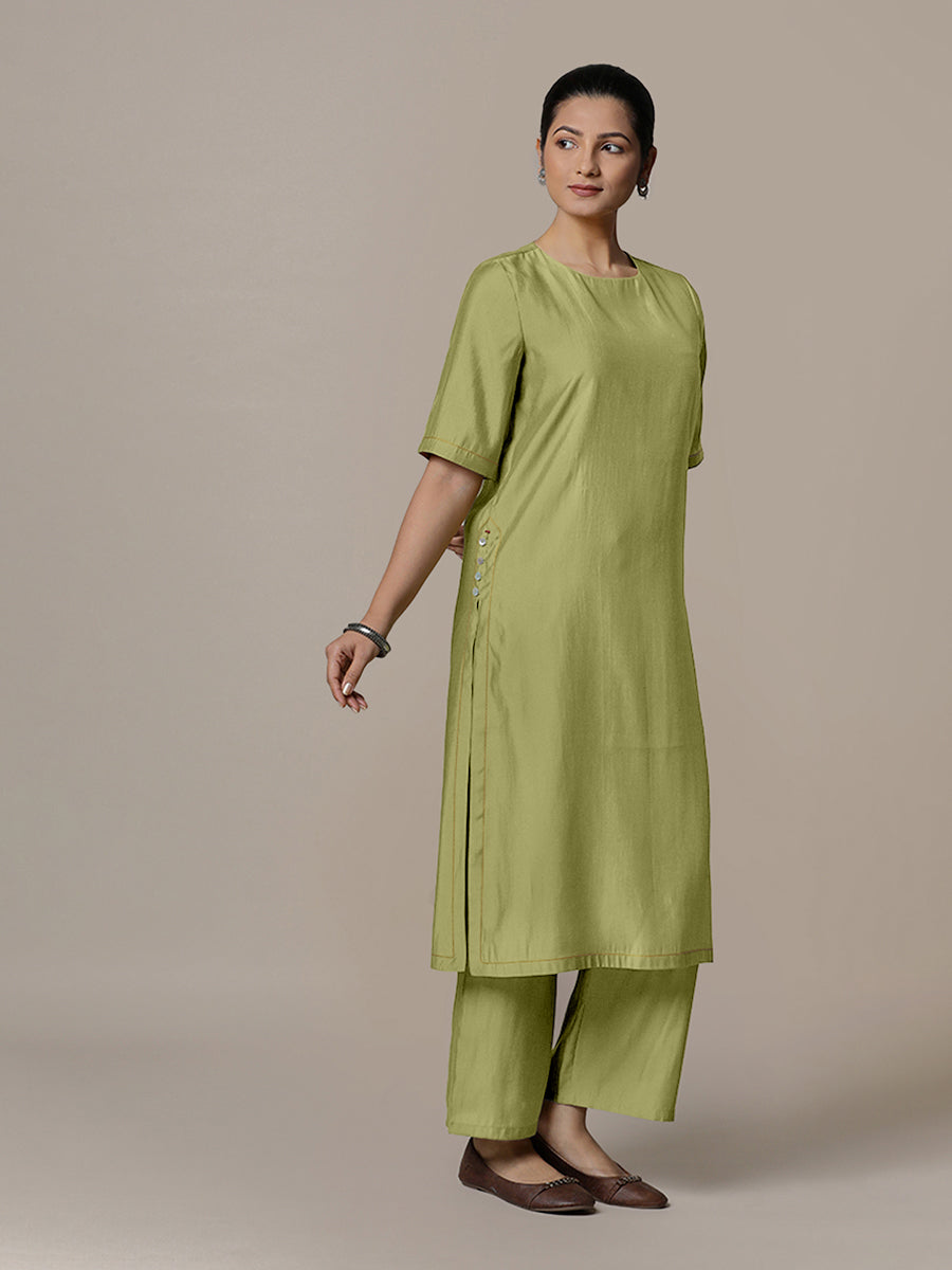 Riya x Rozaana Kurta, in Green Viscose, featuring elbow sleeves and jewel neckline, made for daily & work.