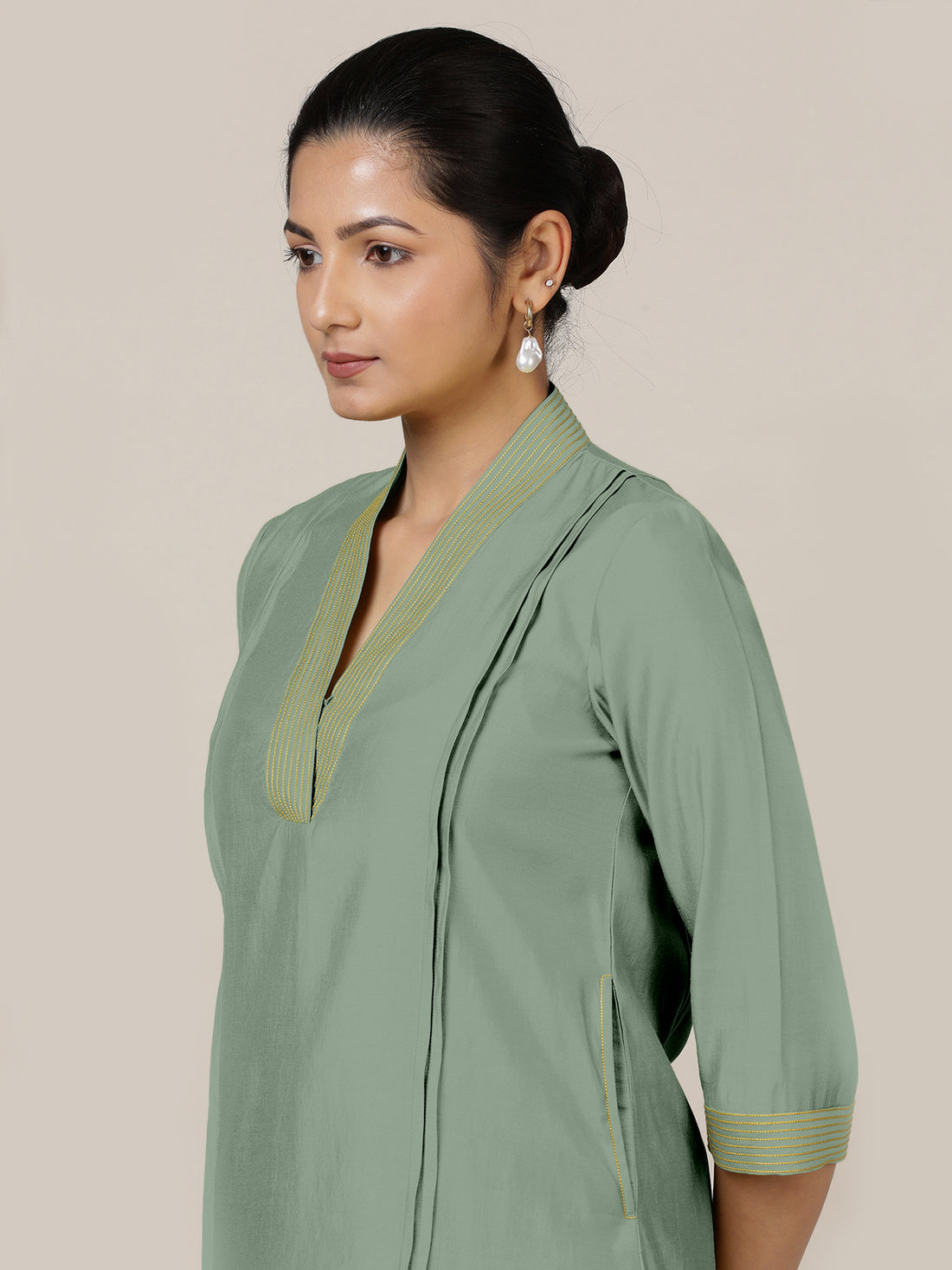 Vanya x Rozaana Kurta, in Green Viscose, featuring three quarter sleeves and band collar neckline, made for daily & work.