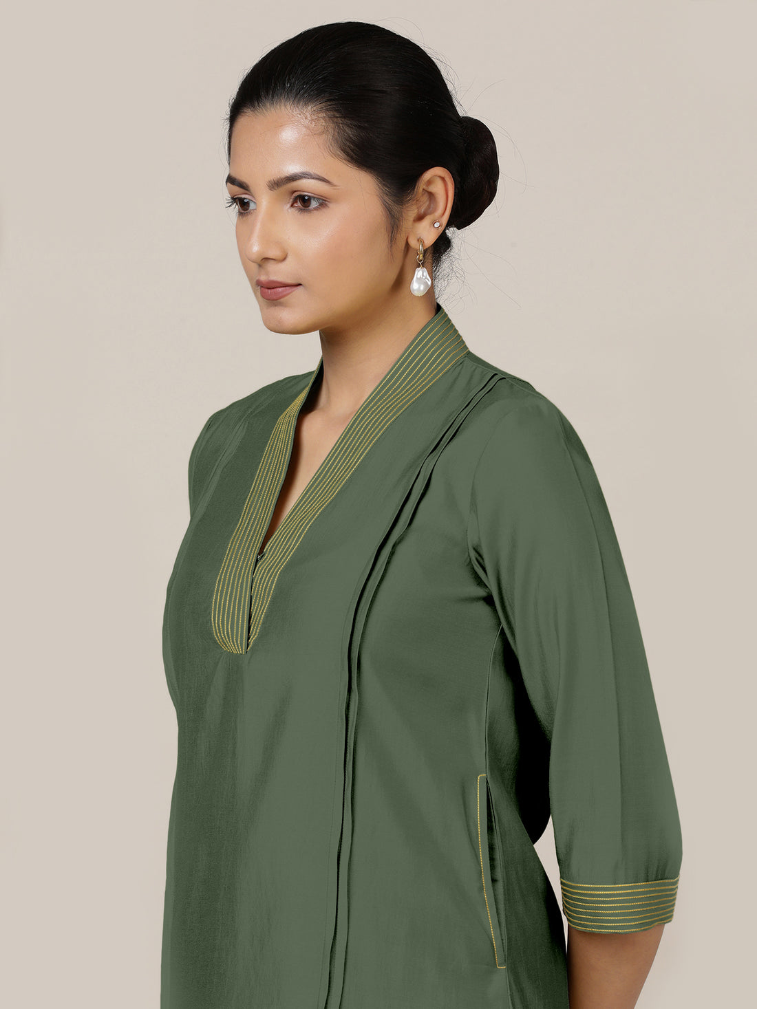 Vanya x Rozaana Kurta, in Green Viscose, featuring three quarter sleeves and band collar neckline, made for daily & work.