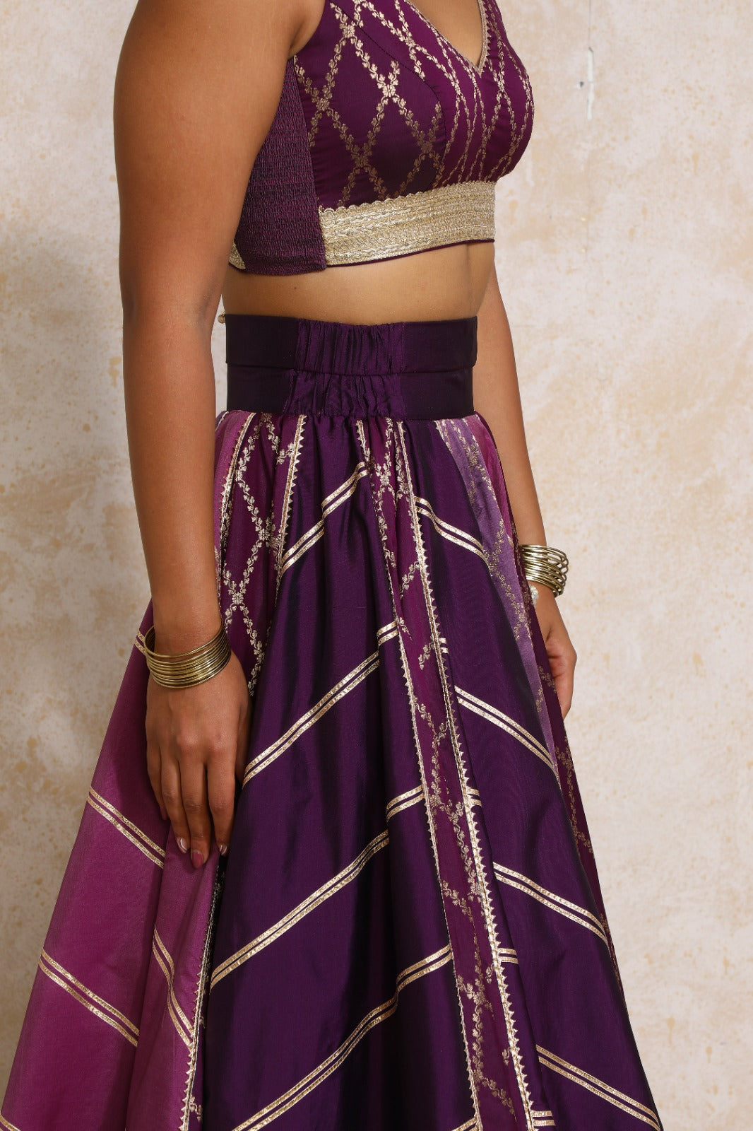 Raahi x Tyohaar Lehenga Set, in Purple Viscose Silk Brocade, featuring sleeveless and curved v-neckline (view 5).