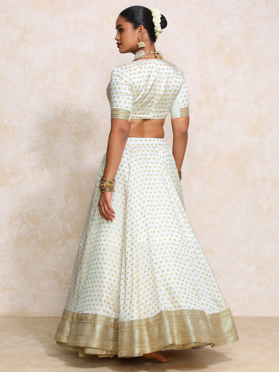 Saniya x Tyohaar Lehenga Set, in Cream Butta Satin Viscose, featuring elbow sleeves and v-neckline, made for party & festive.
