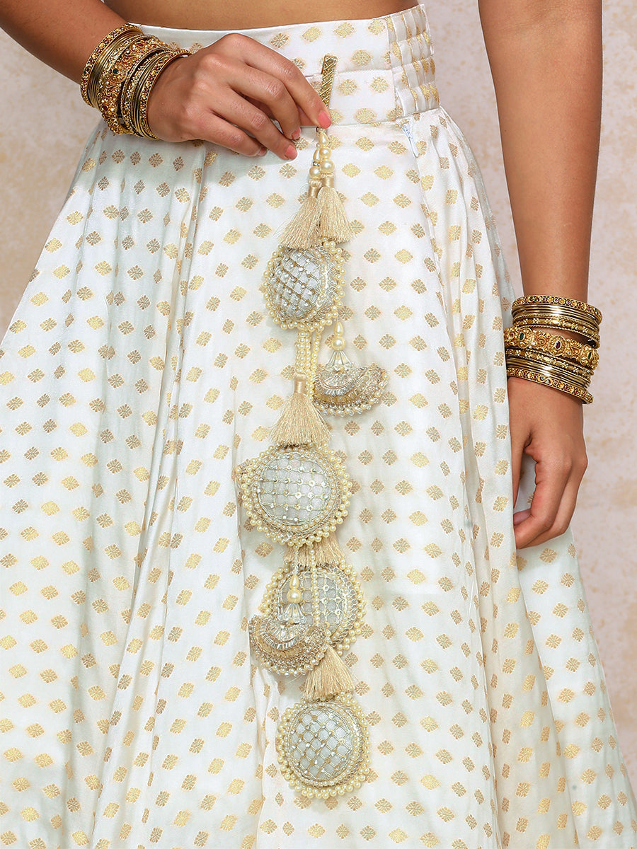 Saniya x Tyohaar Lehenga Set, in Cream Butta Satin Viscose, featuring elbow sleeves and v-neckline, made for party & festive.