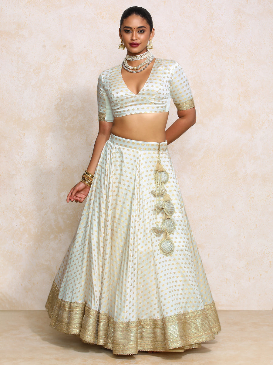 Saniya x Tyohaar Lehenga Set, in Cream Butta Satin Viscose, featuring elbow sleeves and v-neckline, made for party & festive.