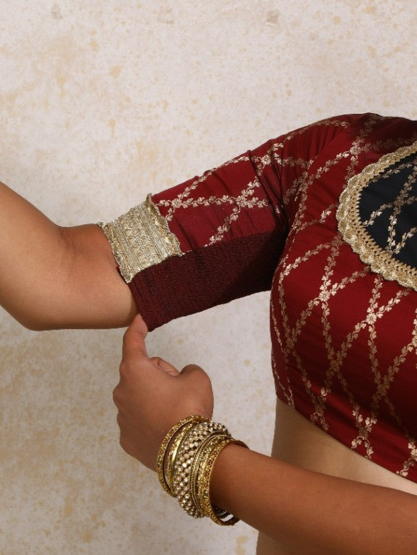 Amaavi x Tyohaar Saree Blouse, in Maroon Viscose Silk Brocade, featuring elbow sleeves and jewel neckline (view 4).