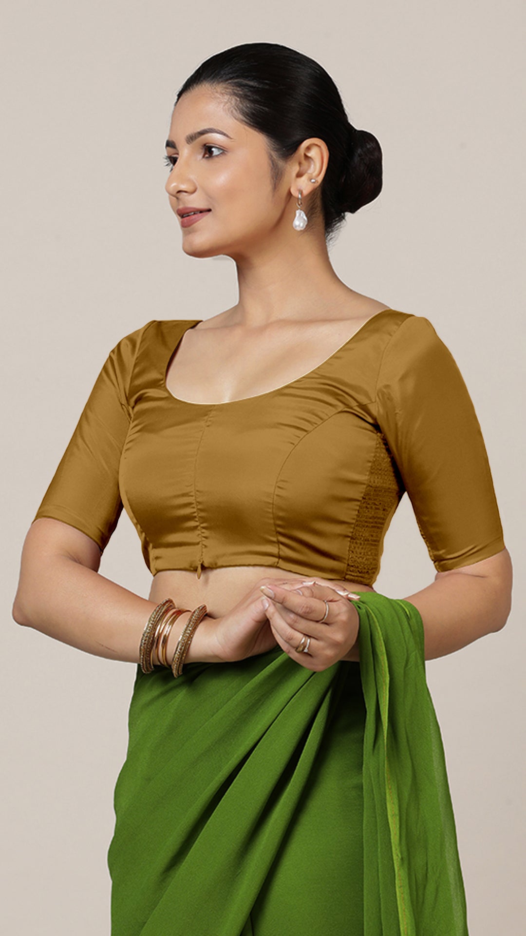 Anisha x Rozaana Saree Blouse, in Gold Vegan Silk, featuring elbow sleeves and round neckline, made for daily & work.