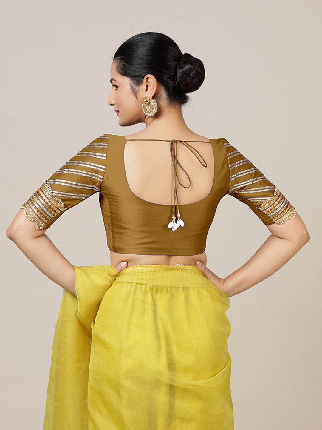 Anisha x Tyohaar Saree Blouse, in Gold Vegan Silk, featuring elbow sleeves and round neckline, made for party & festive.