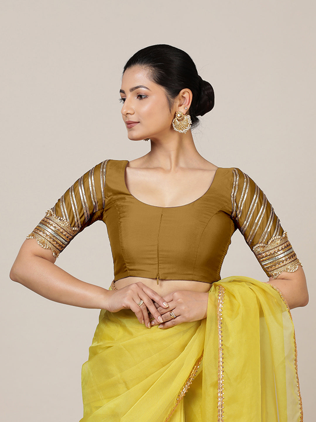 Anisha x Tyohaar Saree Blouse, in Gold Vegan Silk, featuring elbow sleeves and round neckline, made for party & festive.