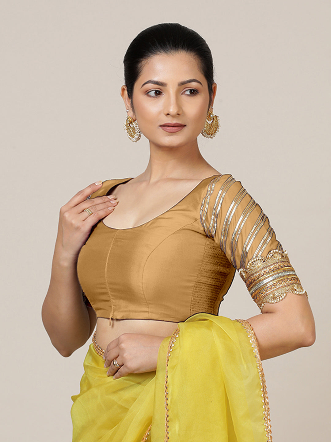 Anisha x Tyohaar Saree Blouse, in Gold Vegan Silk, featuring elbow sleeves and round neckline, made for party & festive.