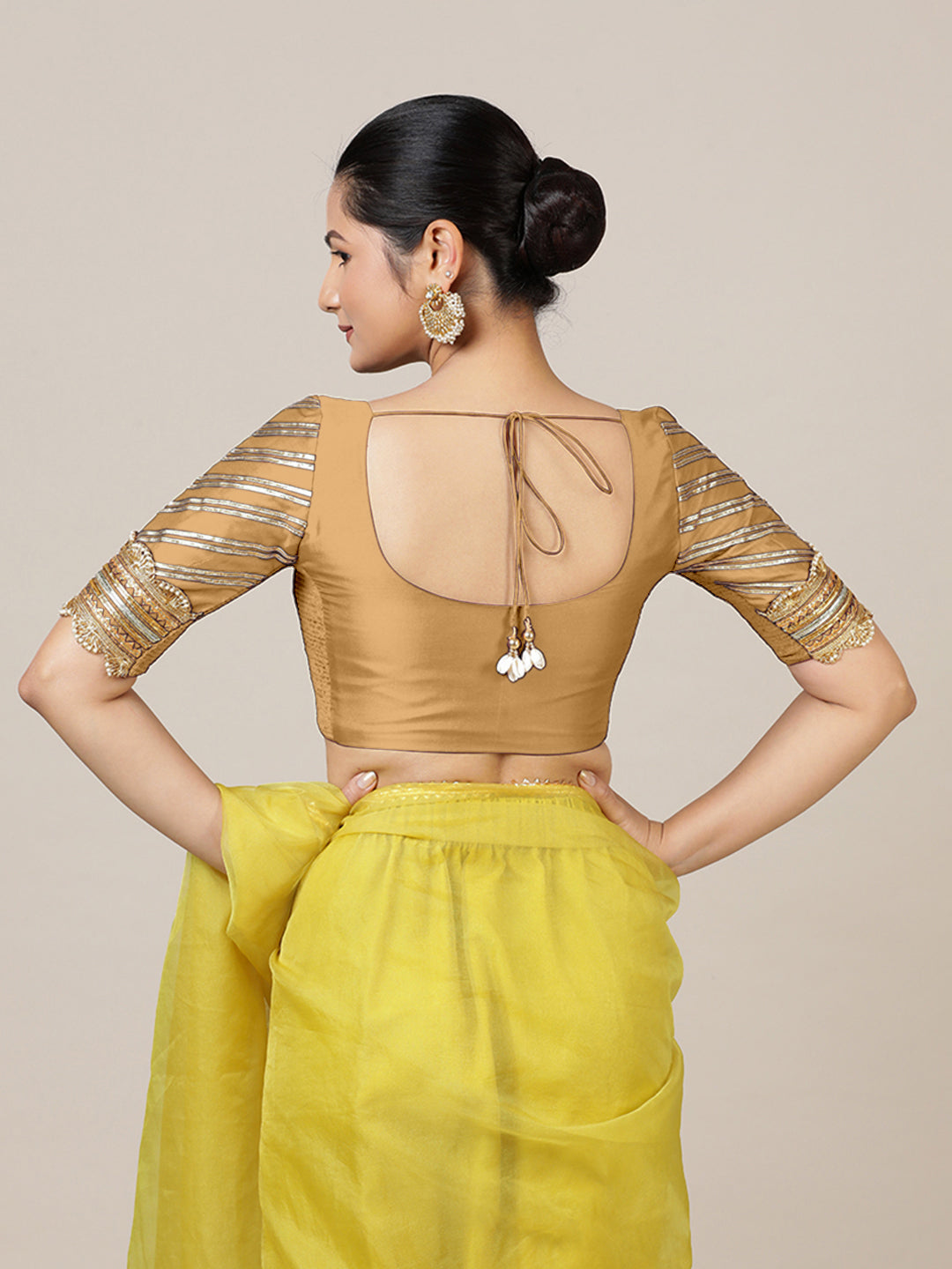 Anisha x Tyohaar Saree Blouse, in Gold Vegan Silk, featuring elbow sleeves and round neckline, made for party & festive.