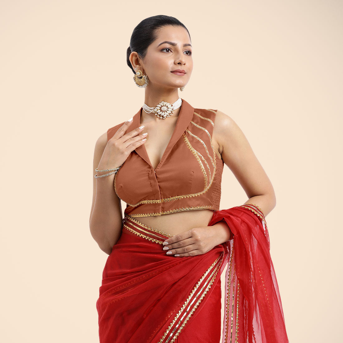 Avni x Tyohaar Saree Blouse, in Copper Vegan Silk, featuring sleeveless and shawl neckline, made for party & festive.