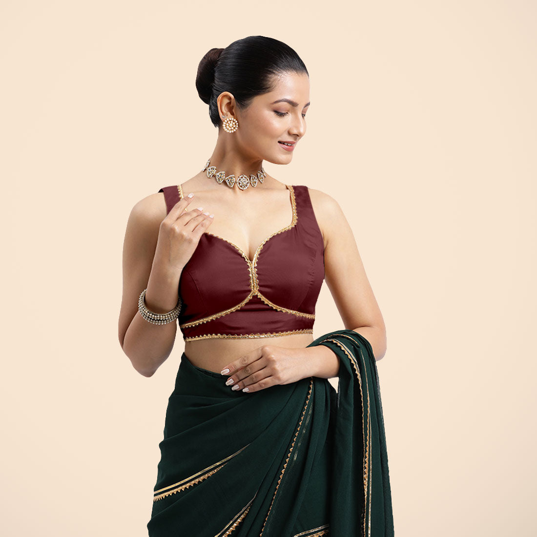 Ishika x Tyohaar Saree Blouse, in Maroon Vegan Silk, featuring sleeveless and sweetheart neckline, made for party & festive.