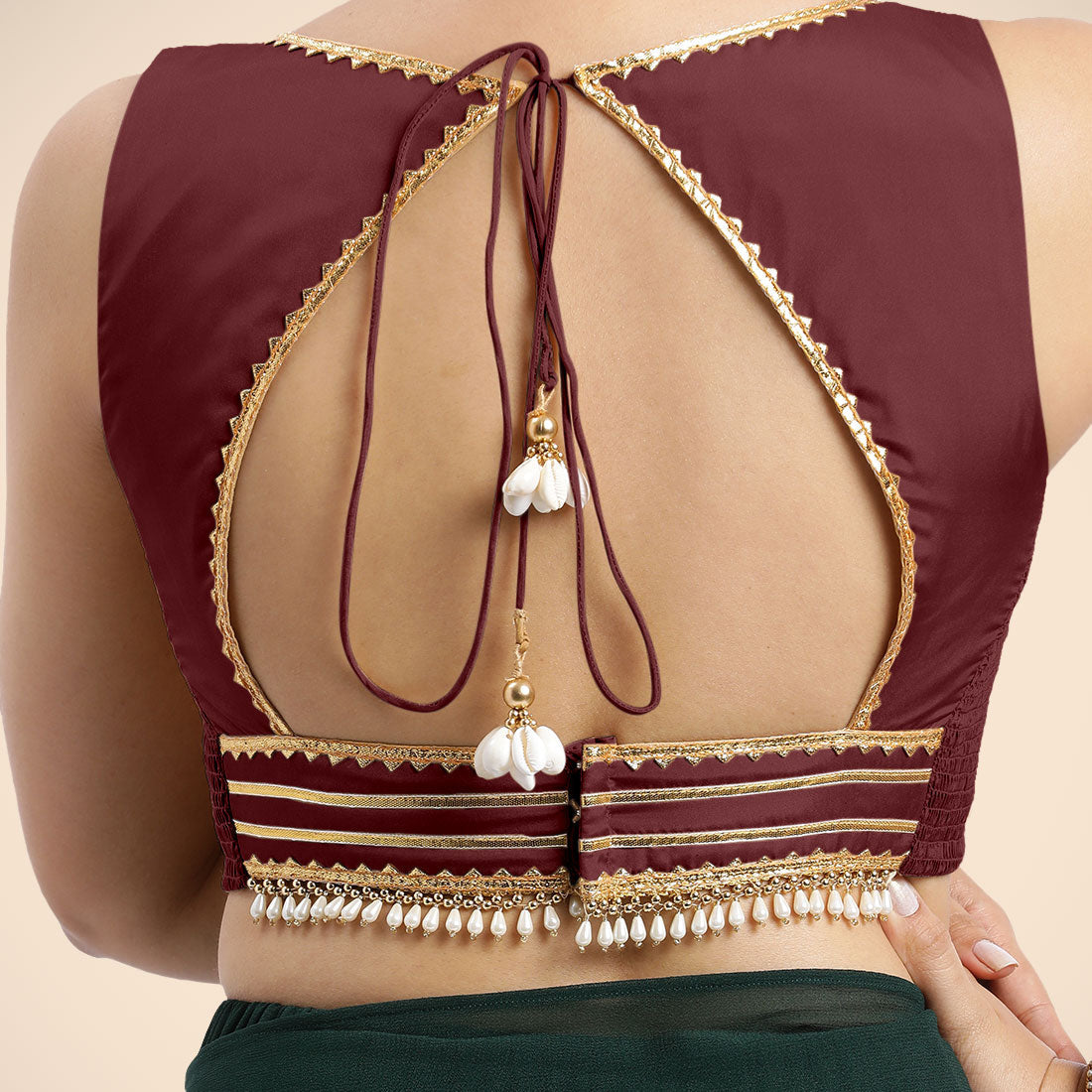 Ishika x Tyohaar Saree Blouse, in Maroon Vegan Silk, featuring sleeveless and sweetheart neckline, made for party & festive.