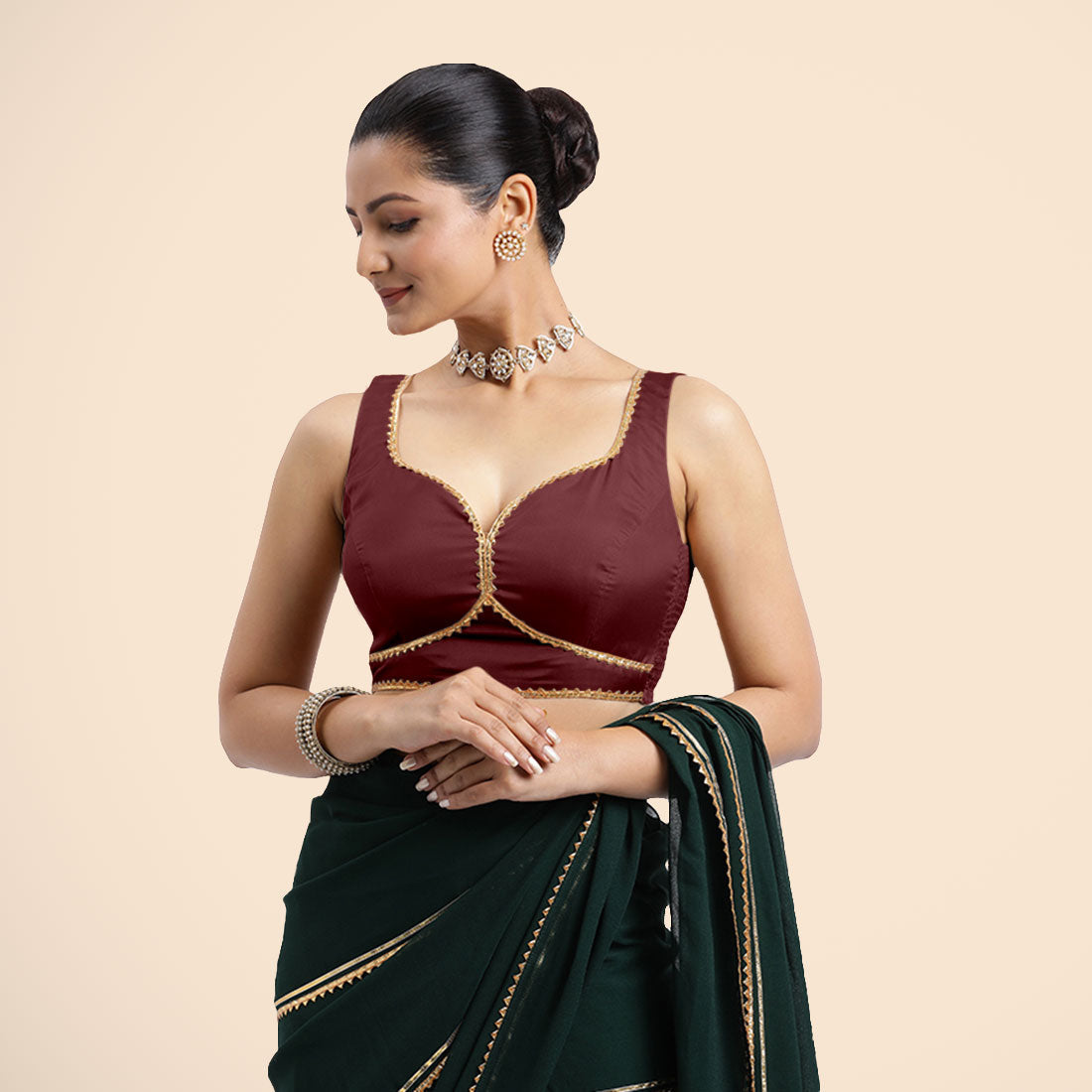 Ishika x Tyohaar Saree Blouse, in Maroon Vegan Silk, featuring sleeveless and sweetheart neckline, made for party & festive.