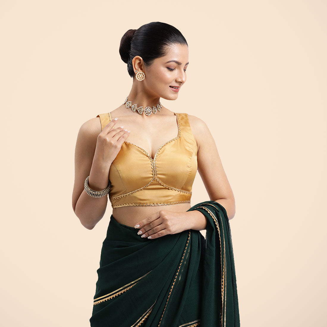 Ishika x Tyohaar Saree Blouse, in Gold Vegan Silk, featuring sleeveless and sweetheart neckline, made for party & festive.