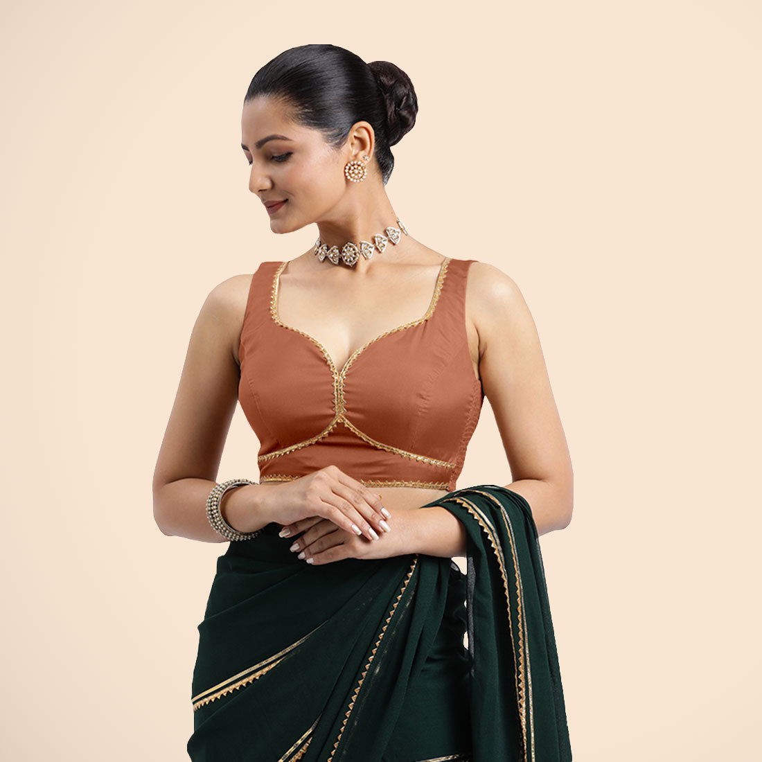 Ishika x Tyohaar Saree Blouse, in Copper Vegan Silk, featuring sleeveless and sweetheart neckline, made for party & festive.