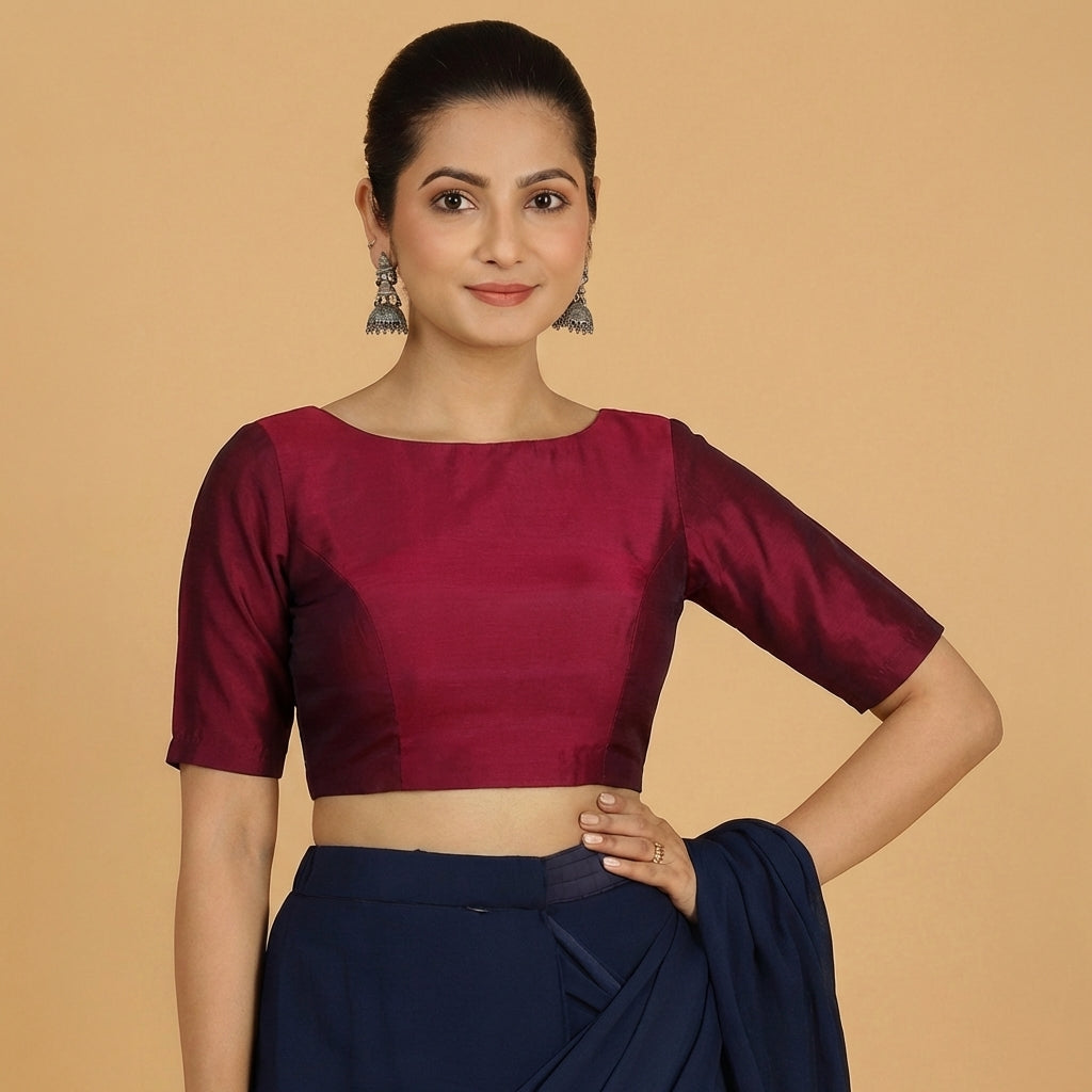 Jigyasa x Tyohaar Saree Blouse, in Maroon Chandheri, featuring elbow sleeves and boat neckline, made for party & festive.