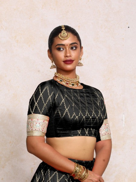 Kashvi x Tyohaar Saree Blouse, in Black Viscose Silk Brocade, featuring elbow sleeves and jewel neckline (view 4).
