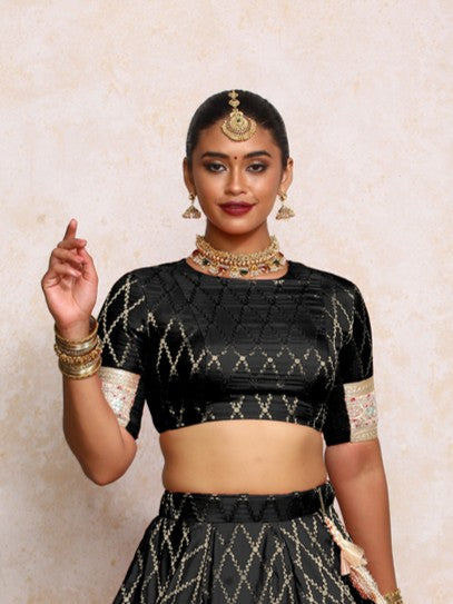 Kashvi x Tyohaar Saree Blouse, in Black Viscose Silk Brocade, featuring elbow sleeves and jewel neckline (view 5).
