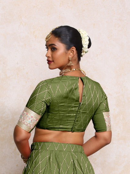 Kashvi x Tyohaar Saree Blouse, in Green Viscose Silk Brocade, featuring elbow sleeves and jewel neckline (view 2).