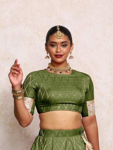 Kashvi x Tyohaar Saree Blouse, in Green Viscose Silk Brocade, featuring elbow sleeves and jewel neckline (view 5).