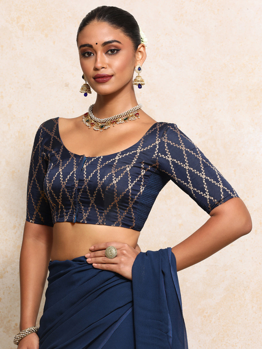 Kumkum x Tyohaar Saree Blouse, in Blue Viscose Silk Brocade, featuring elbow sleeves and round neckline.
