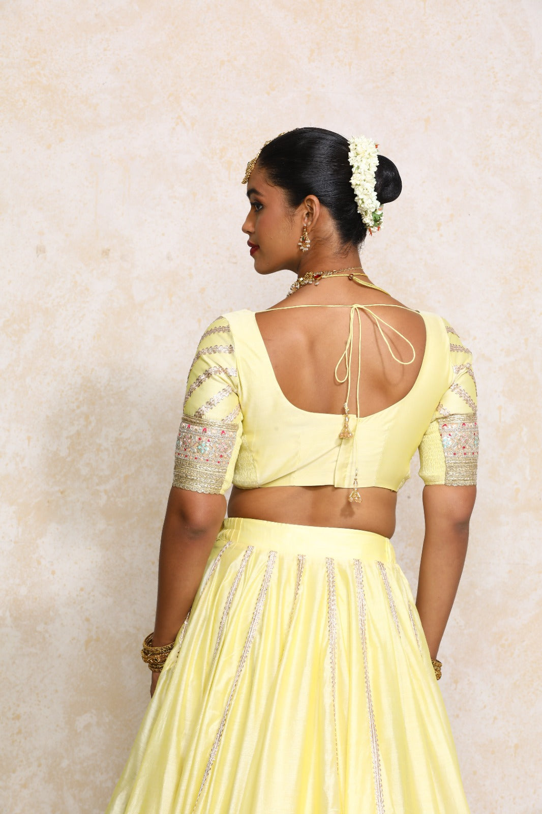 Manika x Tyohaar Saree Blouse, in Yellow Chandheri, featuring elbow sleeves and scoop neckline, made for party & festive.