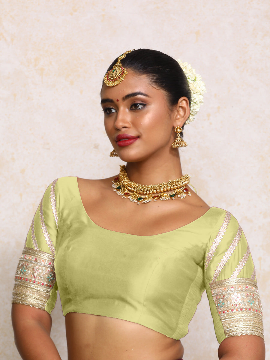 Manika x Tyohaar Saree Blouse, in Green Chandheri, featuring elbow sleeves and scoop neckline, made for party & festive.