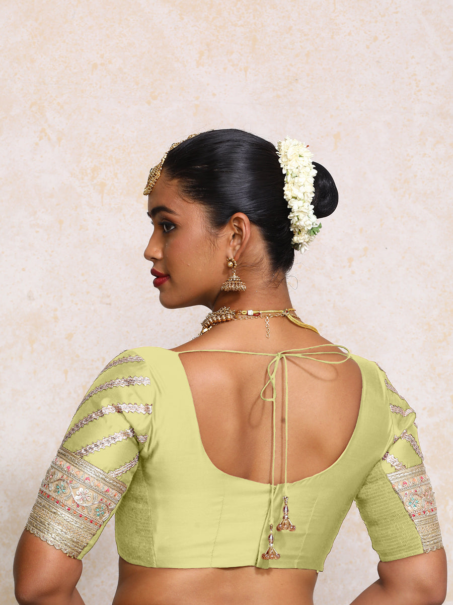 Manika x Tyohaar Saree Blouse, in Green Chandheri, featuring elbow sleeves and scoop neckline, made for party & festive.