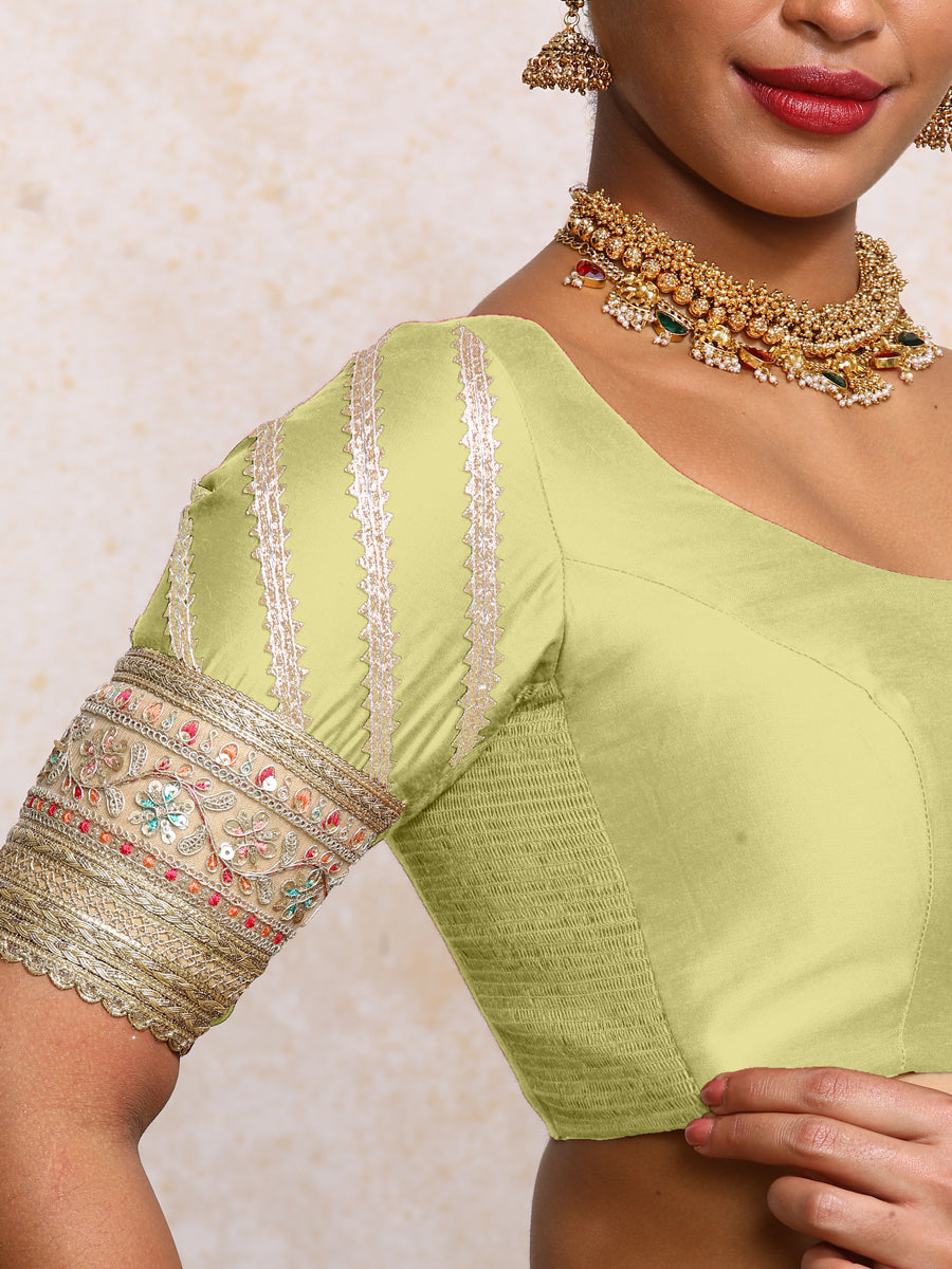 Manika x Tyohaar Saree Blouse, in Green Chandheri, featuring elbow sleeves and scoop neckline, made for party & festive.