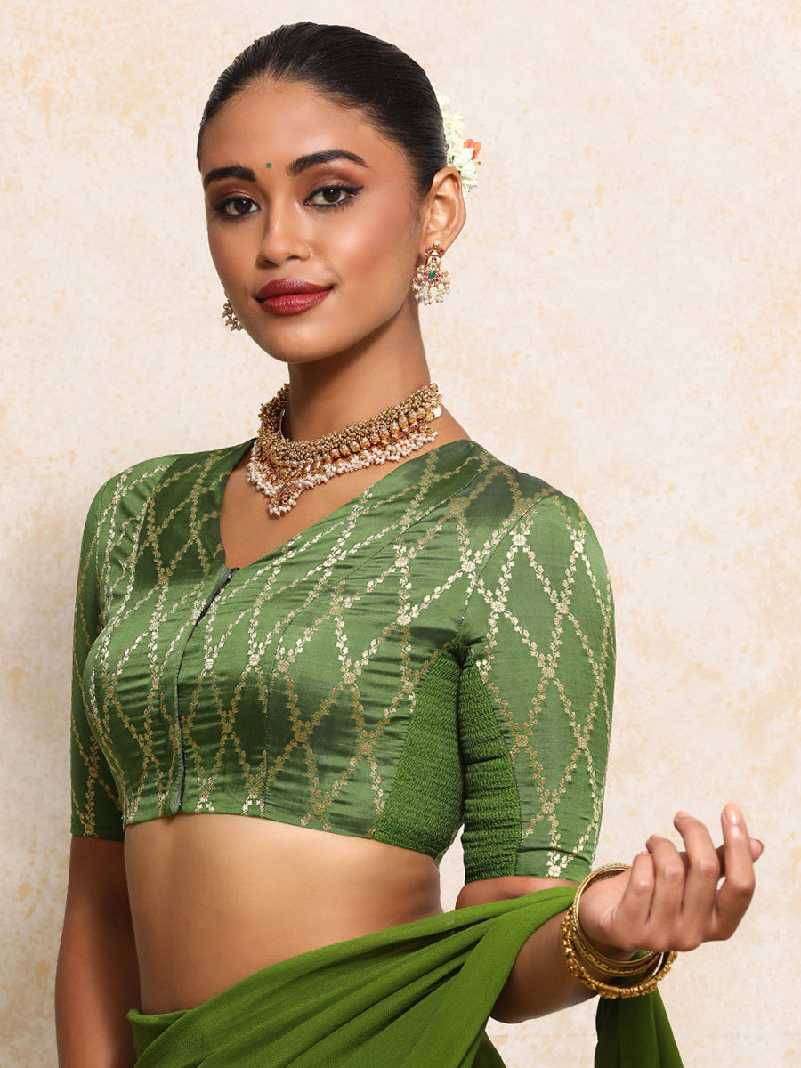Manisha x Tyohaar Saree Blouse, in Green Viscose Silk Brocade, featuring elbow sleeves and v-neckline.