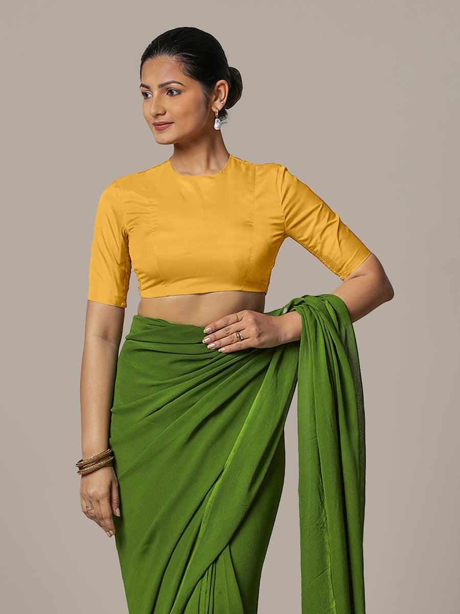 Myra x Rozaana Saree Blouse, in Yellow Artificial Silk, featuring elbow sleeves and jewel neckline, made for party & festive.