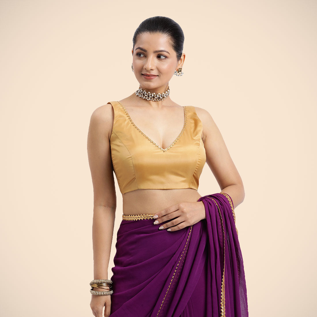 Raisa x Tyohaar Saree Blouse, in Gold Vegan Silk, featuring sleeveless and curved v-neckline, made for party & festive.