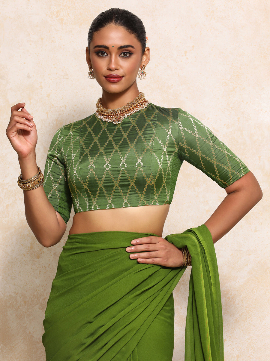 Reena x Tyohaar Saree Blouse, in Green Viscose Silk Brocade, featuring elbow sleeves and jewel neckline (view 7).