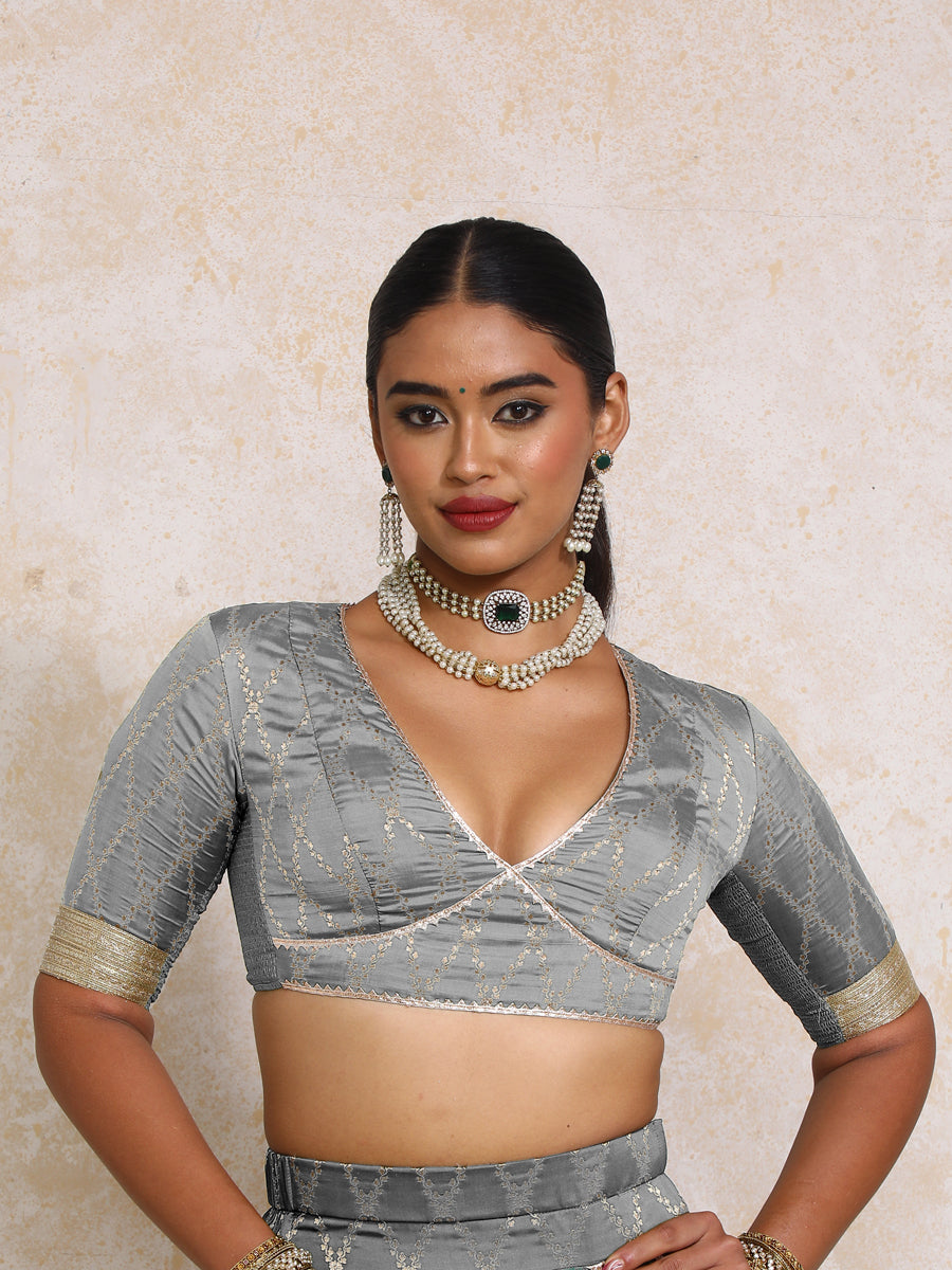 Rivya x Tyohaar Saree Blouse, in Grey Viscose Silk Brocade, featuring elbow sleeves and v-neckline, made for party & festive.
