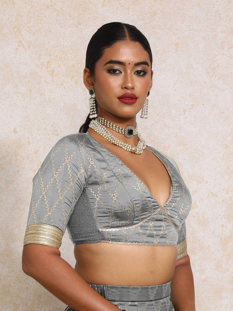 Rivya x Tyohaar Saree Blouse, in Grey Viscose Silk Brocade, featuring elbow sleeves and v-neckline, made for party & festive.
