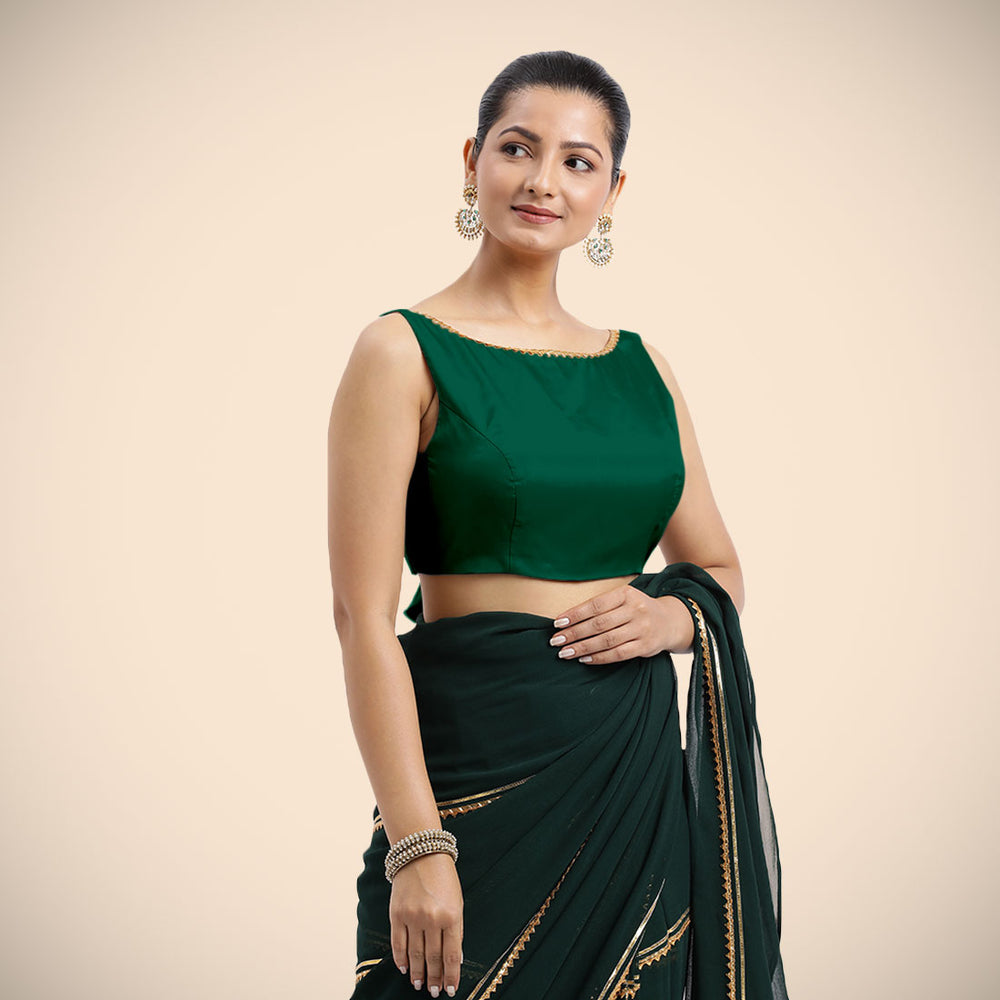 Sherry x Tyohaar | Bottle Green Sleeveless FlexiFit™ Saree Blouse with Simple Golden Gota Lace on Neckline and Removable Bow on Back