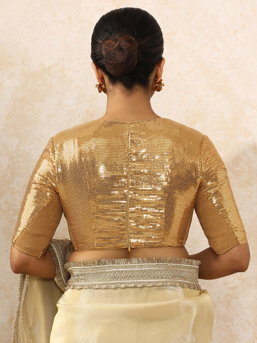 Shireen x Tyohaar Saree Blouse, in Gold Sequin Fabric, featuring elbow sleeves and v-neckline, made for party & festive.