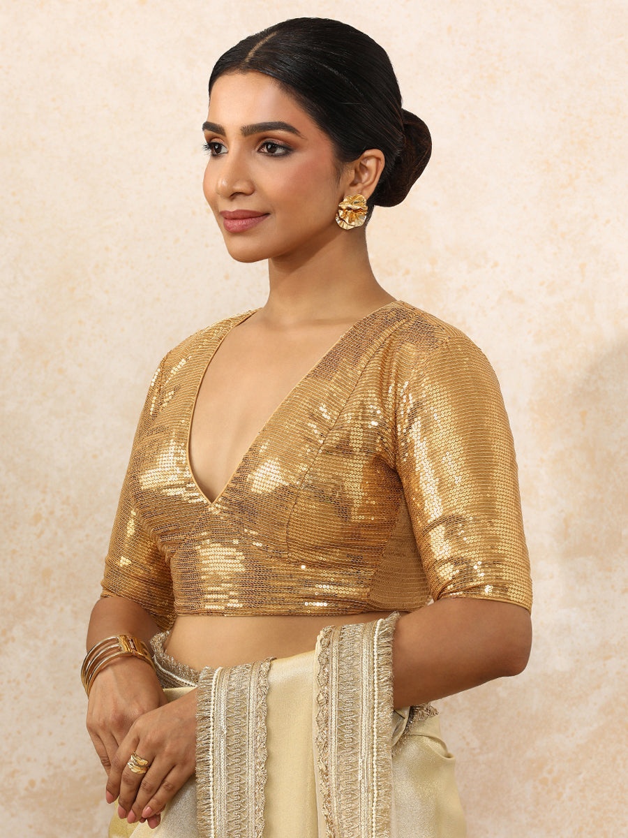 Shireen x Tyohaar Saree Blouse, in Gold Sequin Fabric, featuring elbow sleeves and v-neckline, made for party & festive.