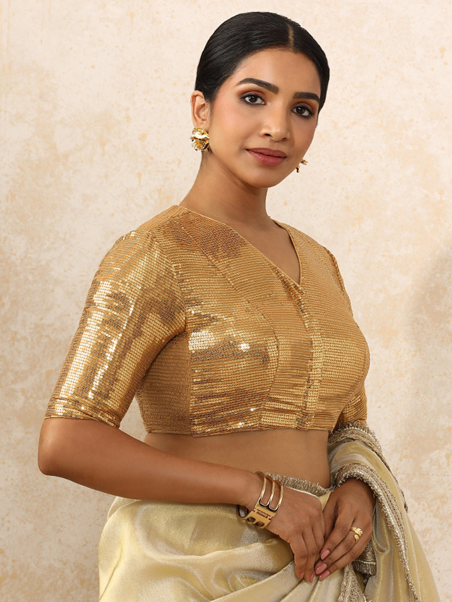 Sunidhi x Tyohaar Saree Blouse, in Gold Sequin Fabric, featuring elbow sleeves and v-neckline, made for party & festive.