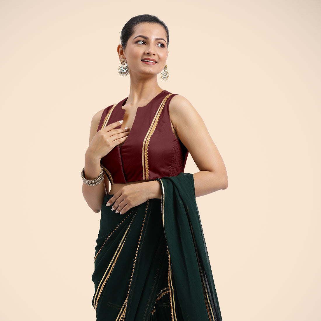 Veena x Tyohaar Saree Blouse, in Maroon Vegan Silk, featuring sleeveless and curved v-neckline, made for party & festive.