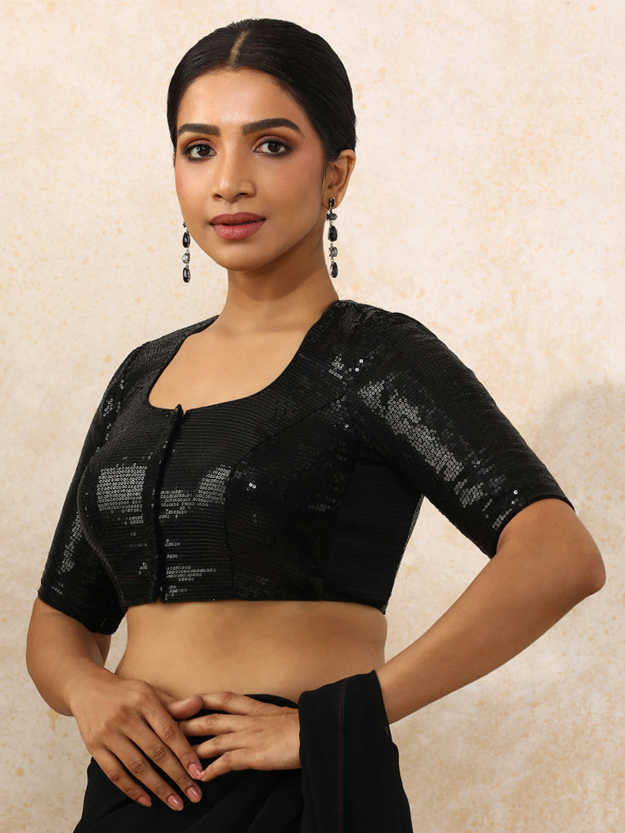 Yashvi x Tyohaar Saree Blouse, in Black Sequin Fabric, featuring elbow sleeves and pot neckline, made for party & festive.