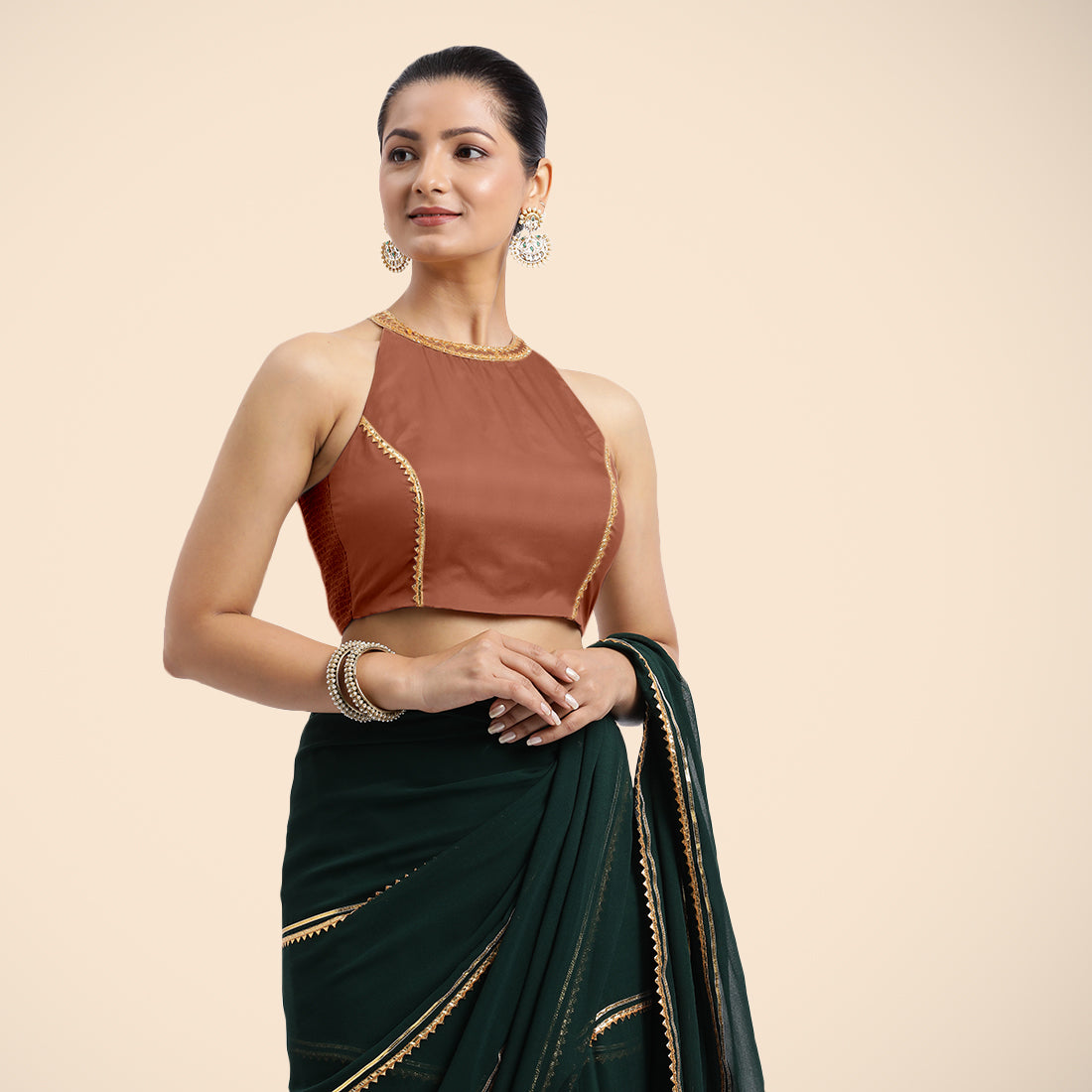 Zubeida x Tyohaar Saree Blouse, in Copper Vegan Silk, featuring sleeveless and halter neckline, made for party & festive.