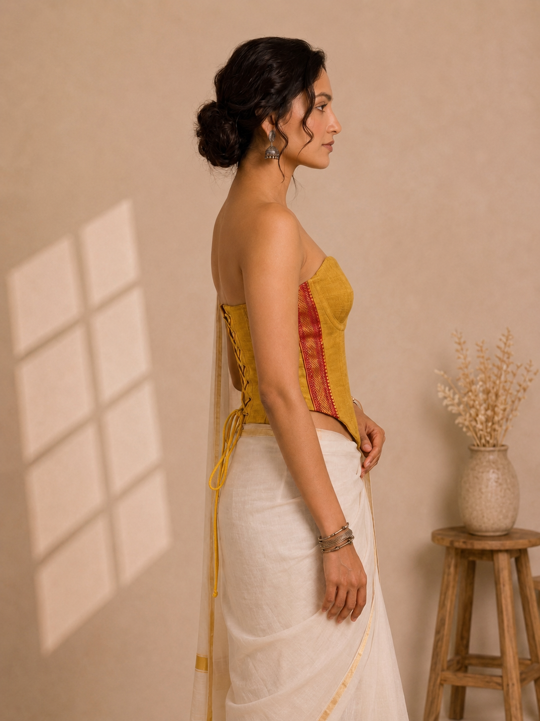 Kasavu-Kit Kasavu Saree with Vihana Off-Shoulder Sleeveless Corset blouse in Turmeric Yellow Mangalgiri