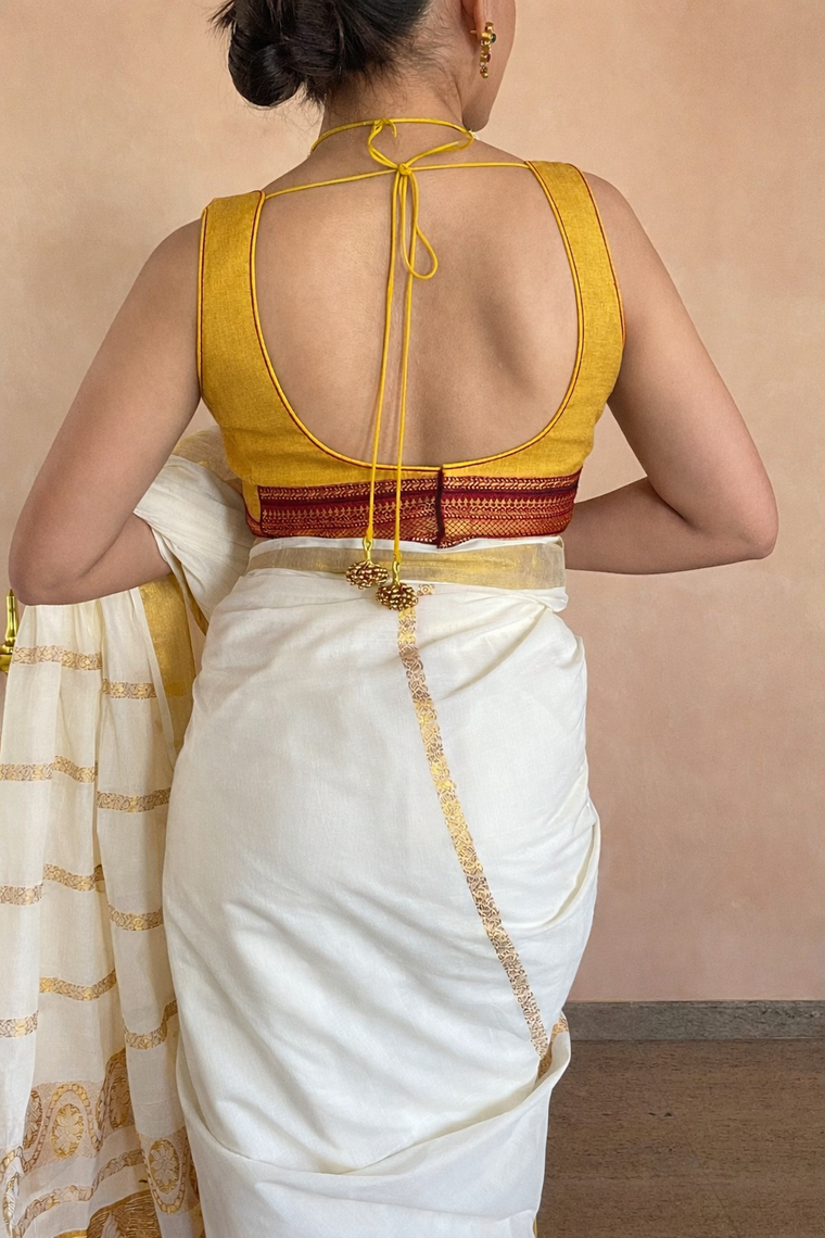 Kasavu-Kit Kasavu Saree with Amala Sleeveless blouse in Turmeric Yellow