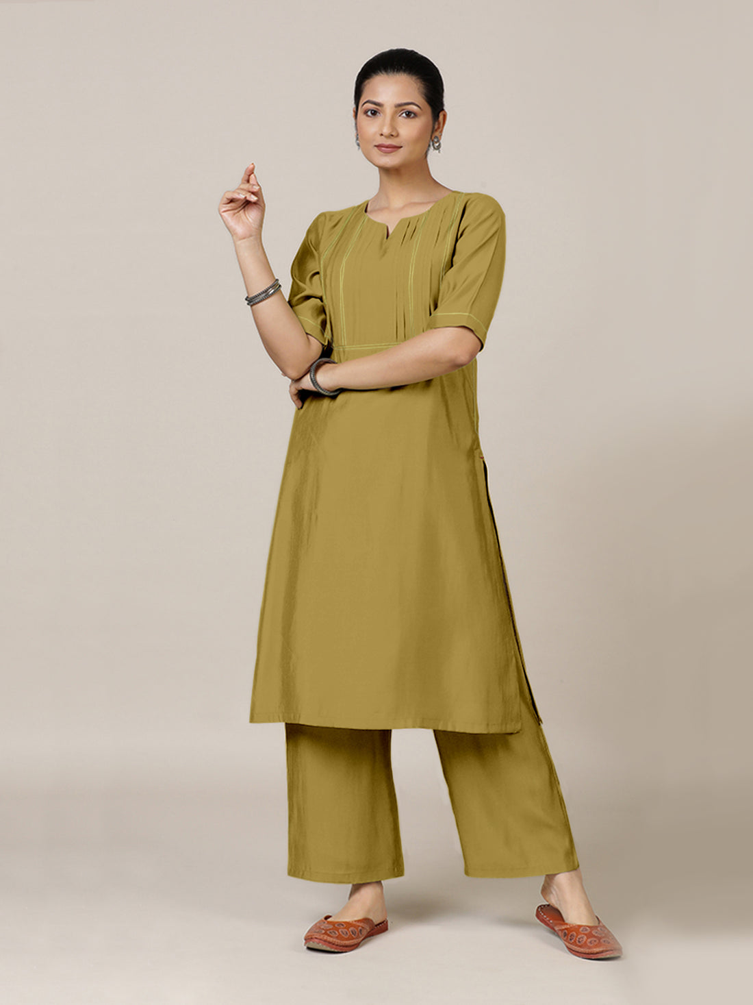 Esha x Rozaana Kurta, in Yellow Viscose, featuring elbow sleeves and round neck with splitline, made for daily & work.