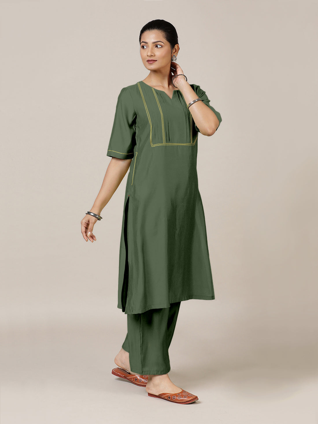 Esha x Rozaana Kurta, in Green Viscose, featuring elbow sleeves and round neck with splitline, made for daily & work.