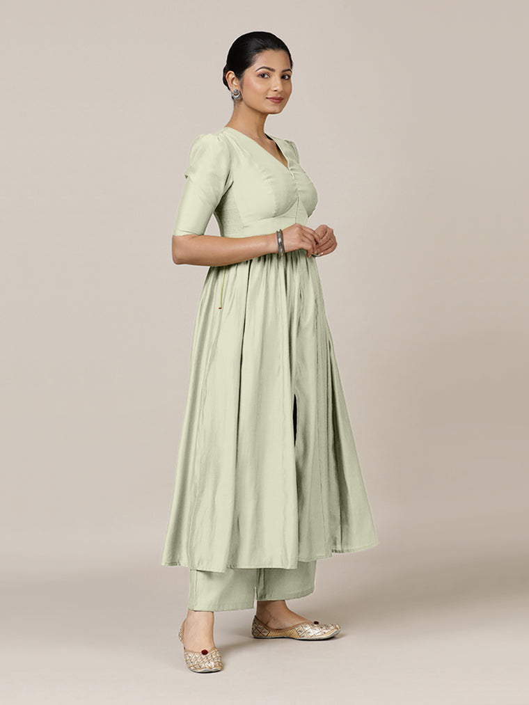 Faiza x Rozaana Kurta, in Cream Viscose, featuring elbow sleeves and v-neckline, made for daily & work.