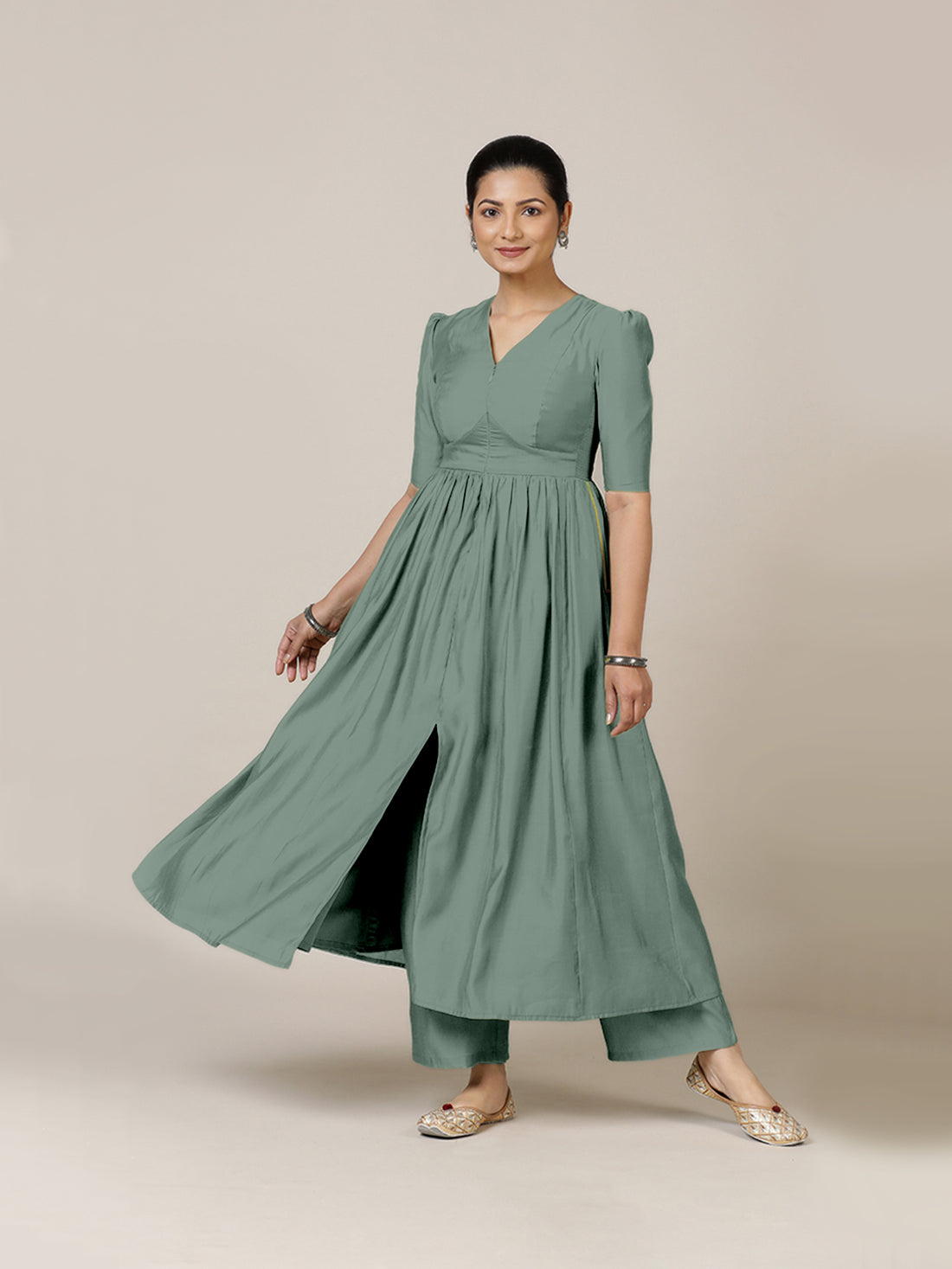 Faiza x Rozaana Kurta, in Green Viscose, featuring elbow sleeves and v-neckline, made for daily & work.